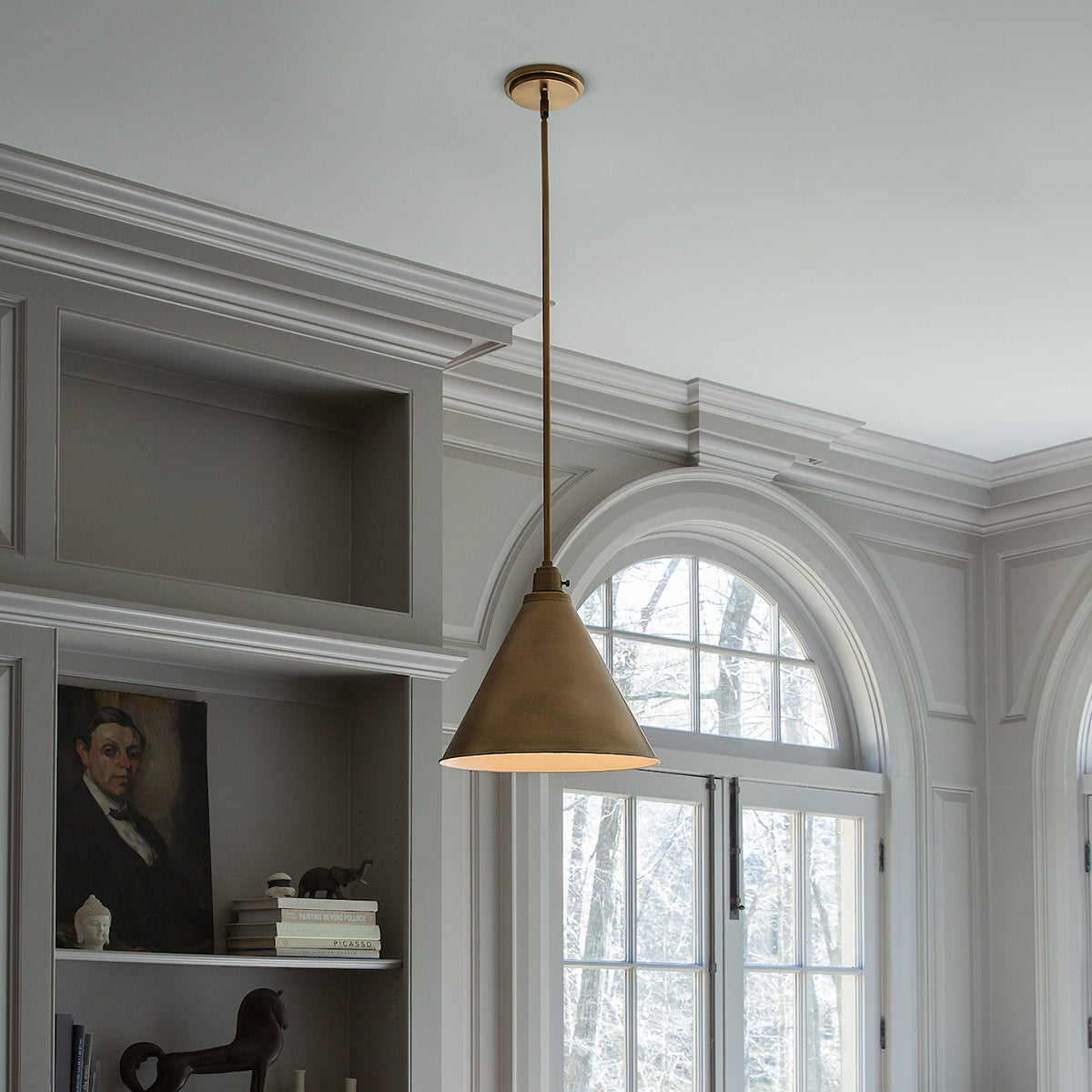 Arti Large Pendant by Hinkley in Heritage Brass, shown in a styled interior