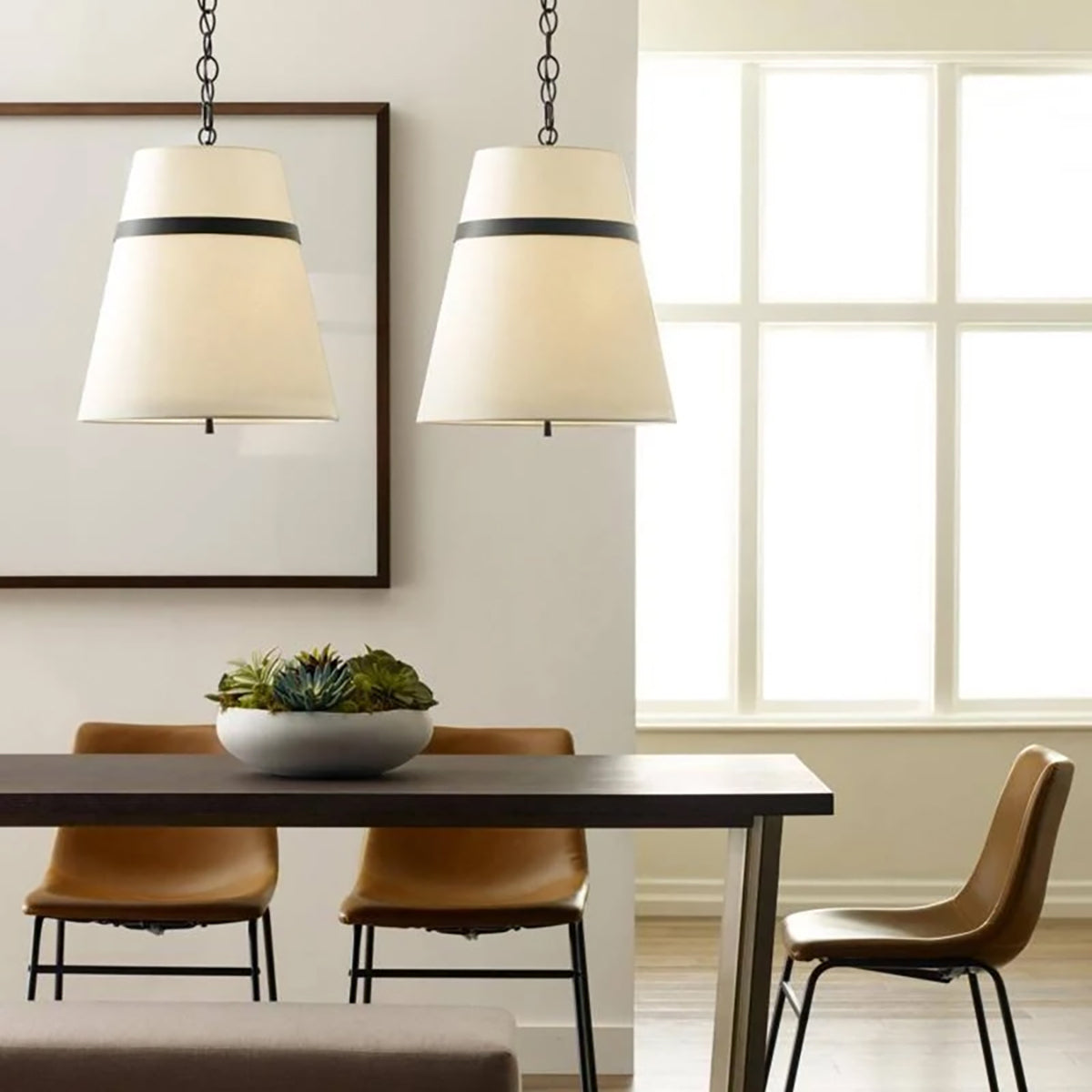 Cordtlandt 3 Light Pendant by Visual Comfort in Aged Iron, shown in a styled interior