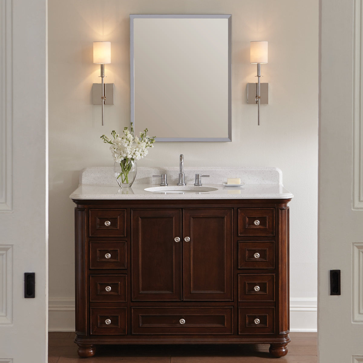 Hewitt Wall Sconce by Visual Comfort in Polished Nickel, shown in a styled interior