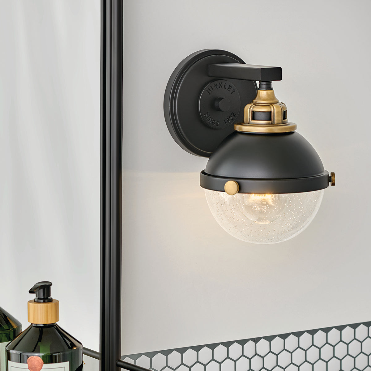 Fletcher Single Wall Bracket by Hinkley in Black, shown in a styled interior