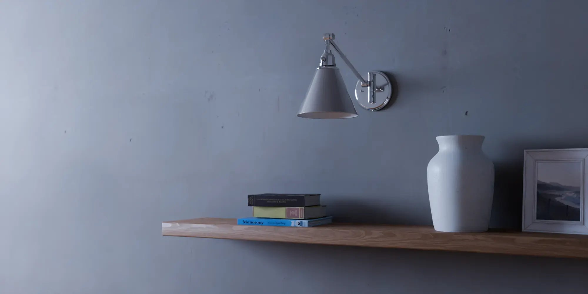Arti Swing-Arm Metal Wall Sconce by Hinkley in Polished Nickel, on a wall above a floating oak shelf